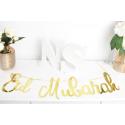 The Eid mubarak gold cardboard banner